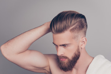 Top above side profile half-turned photo of handsome serious concentrated neat groomed confident stylish modern fashionable guy boasting showing his healthy hair isolated on gray background