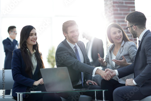 Cuadros en Lienzo Successful partnership in business displayed by shaking hands in