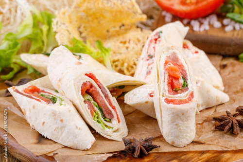 Cuadros en Lienzo Mini tortilla with salmon on a wooden background. Rustic.