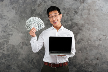 Canvas Print - Portrait of a confident young asian man