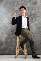 Poster - Full length portrait of a happy young asian man