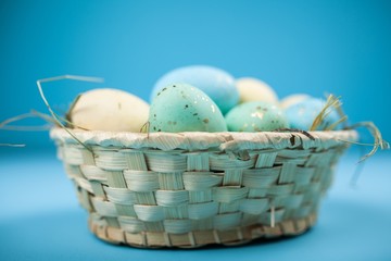 Wall Mural - Easter eggs on blue background