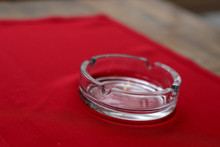 Empty Glass Ashtray On Red Tablecloth