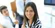 © ASDF - Young businesswoman sitting at desk in office