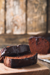 Wall Mural - Slices of chocolate cake on wooden cutting board