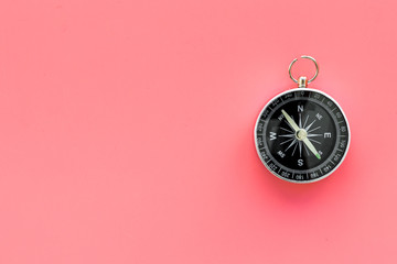 Wall Mural - Direction concept with compass on pink background top view mockup