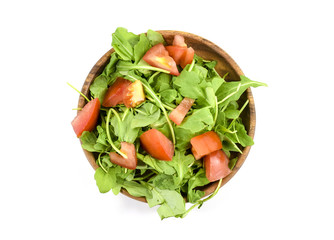 Wall Mural - Fresh arugula and tomato salad on wooden plate