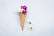 Flowers composition with waffle cones and chrysanthemum on white background. Still life Art Concept. Top view, flat lay, copy space