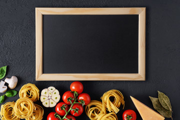 Canvas Print - Ingredients for tagliatelle pasta on a dark background.