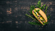 Burger, sandwich with quail egg, cucumber and corn. On a wooden background. Top view. Copy space.