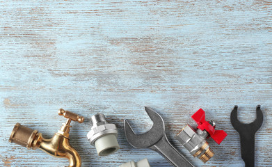 Poster - Plumber's items on wooden background