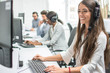 © Bojan - Young smiling operator woman agent with headsets working in a call centre.