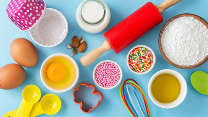 Wall Mural - Baking cake on light blue table