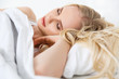 © LIGHTFIELD STUDIOS - beautiful blonde girl sleeping in bed