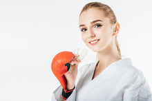 Smiling Female Karate Fighter Holding Mouthguard Isolated On White