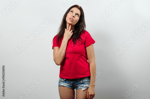 Fotografia, Obraz A young, beautiful girl shows a gesture that she is sick of everything