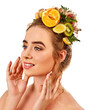 Hair mask from fresh exotic fruits on woman head. Girl with beautiful face hold ingredient for homemade organic skin and hair therapy. Acne Removal.