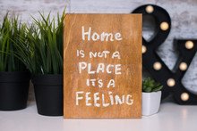 Wooden Board With Motivational Text Home Is Not A Place It's A Feeling