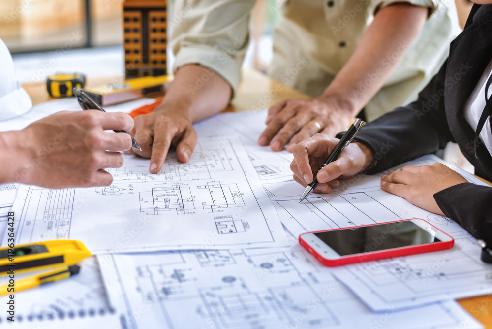 Engineering Project Setup Image of team engineer checks construction blueprints on new project ...