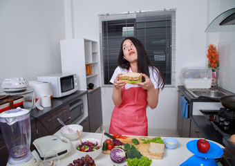 Sticker - woman with a sandwich in kitchen room