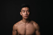 © santypan - Portrait of young asian boy with fitness body.