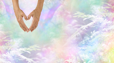 Wall Mural - I LOVE NATURE - female hands making a symbolic heart shape with her hands against a beautiful rainbow colored woodland and fern background with plenty of copy space
