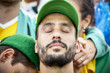 © PhotoAlto - Football fan with head back and eyes closed in disappointment