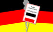 zerrissene Deutsche Flagge mit einem Schild Hoheitsgebiet Deutsches Reich 