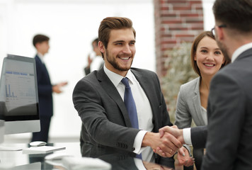 Wall Mural - happy man introducing businesswoman to business partners