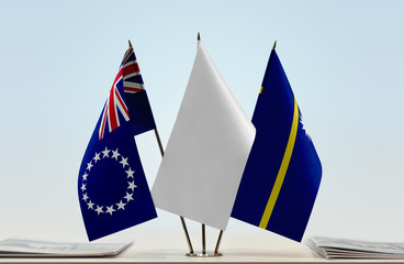 Flags of Cook Islands and Nauru with a white flag in the middle