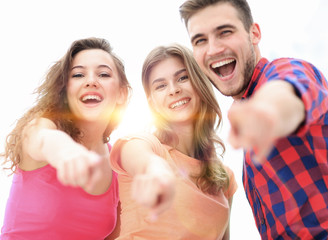 Canvas Print - closeup of three young people showing hands forward