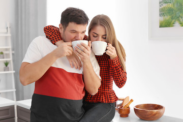 Poster - Cute young lovely couple drinking tea at home