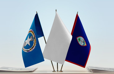 Wall Mural - Flags of Northern Mariana Islands and Guam with a white flag in the middle