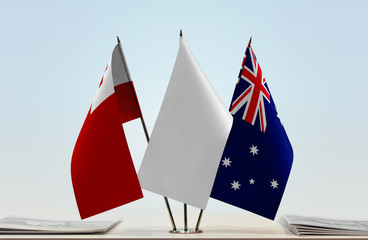 Flags of Tonga and Australia with a white flag in the middle