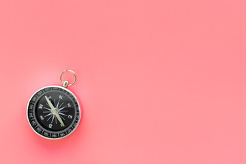 Wall Mural - Compass on pink background top view copy space