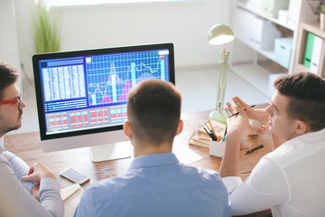 Canvas Print - Young men working in office