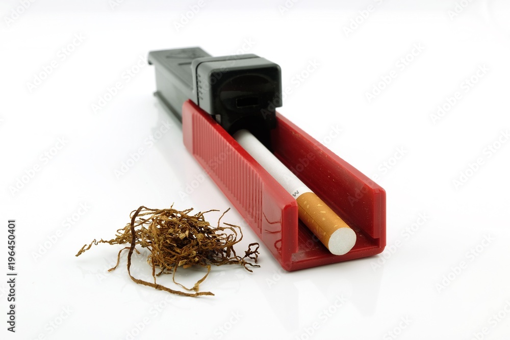 tobacco tube machine Cigarette tube injector rolling machine with smoking tobacco. Isolated on a  white background. Stock Photo