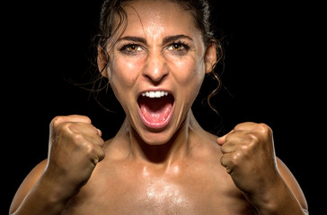 Wall Mural - Isolated female athlete gives champion yell and victorious celebration after win