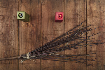 An overhead photo of two candles and a handmade broom with copy space