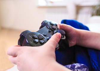 Wall Mural - Close-up of a hand with a joystick