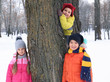 © Africa Studio - Happy children near tree in snowy park on winter vacation