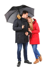 Wall Mural - Young romantic couple with umbrella on white background