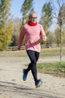 © 2Design - Senior man wearing glasses jogging at the park