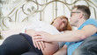 © de Art - pregnant couple husband and wife