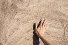 Background With Hand On The Sand