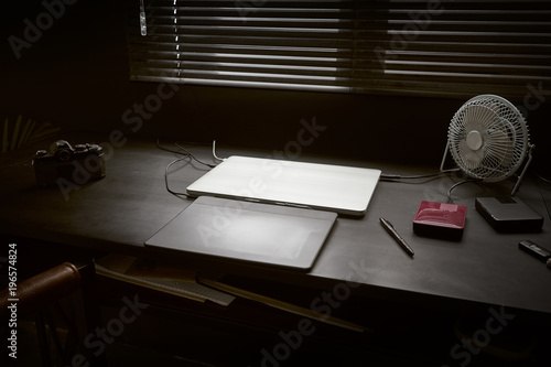 Work Space On Black Table Of A Photographer Or Designer With