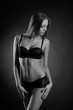 © zhagunov_a - young sexy girl in underwear on a black background