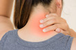 Closeup woman neck and shoulder pain and injury with red highlights on pain area. Health care and medical concept.
