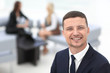 © ASDF - successful businessman on blurred background office
