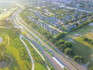 Wall Mural - Aerial view Fourth Ward district west of downtown Houston, Texas, USA. Row of apartment complexes, office buildings, restaurants, parking lots, church bordered by Allen Parkway and Buffalo Bayou River